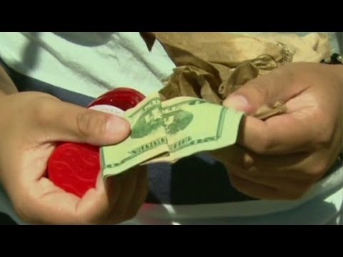 Cash being taken from a toy in the CNN Hidden Cash report